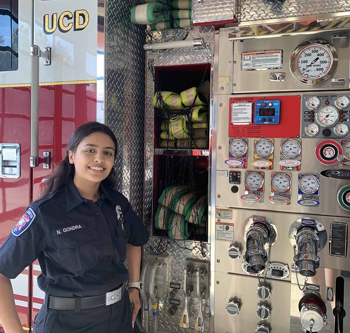 Neha Gondra in front of a fire truck