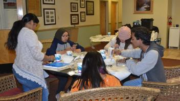Students talking around a table
