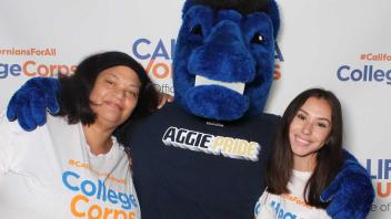 Two UC Davis College Corps students with Gunrock