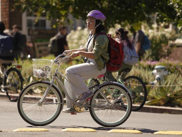 Student Biking with Helmet