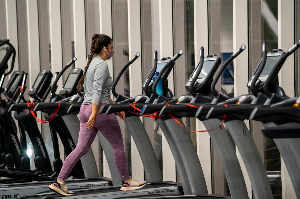 A student walks on the treadmill at the ARC