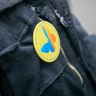 someone wearing a button in support of Undocumented Students