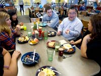 students talking with an administrator