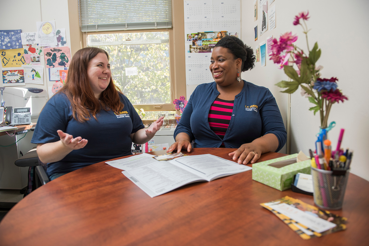 A student discussing with a career advisor