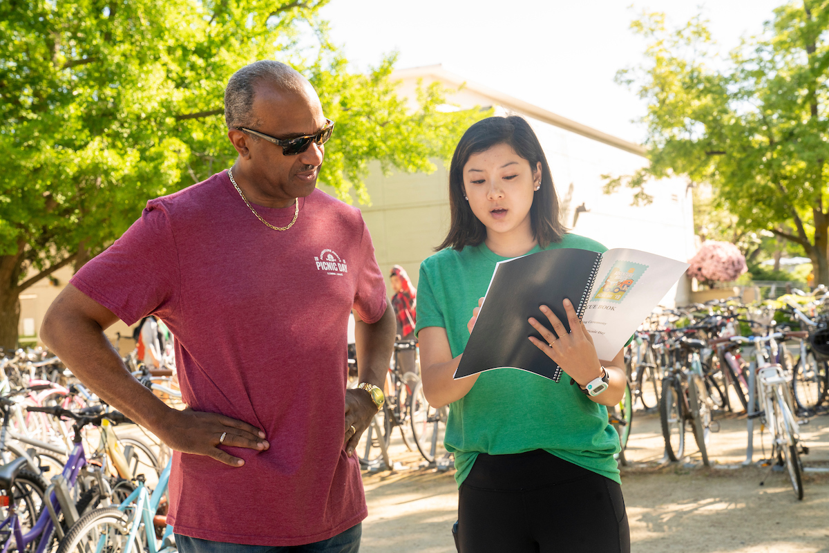 A 2019 Picnic Day board member talks to Gary May before the parade