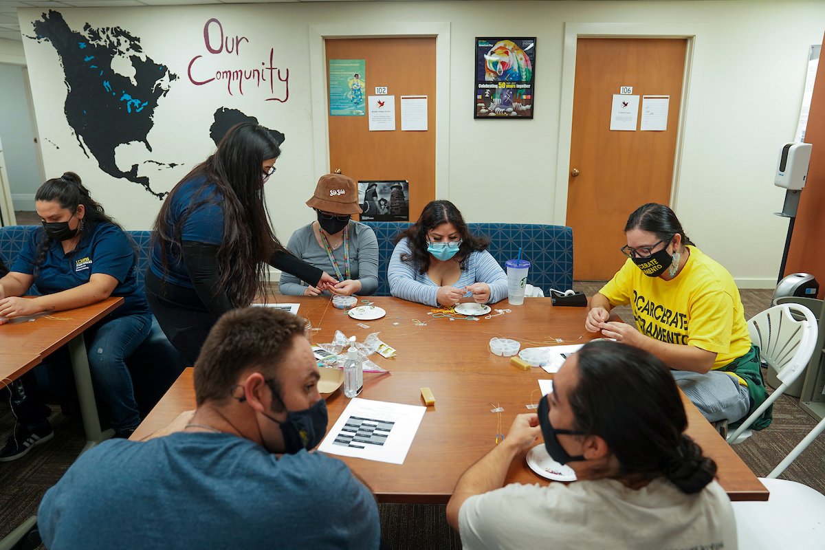 Students attend a beading event at the NAASSC