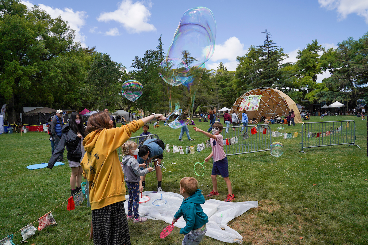 Children create bubbles at the Whole Earth Festival 2022