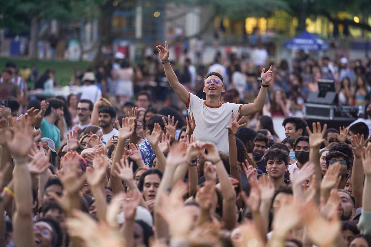 A student being carried above the crowd at Lawntopia 2022