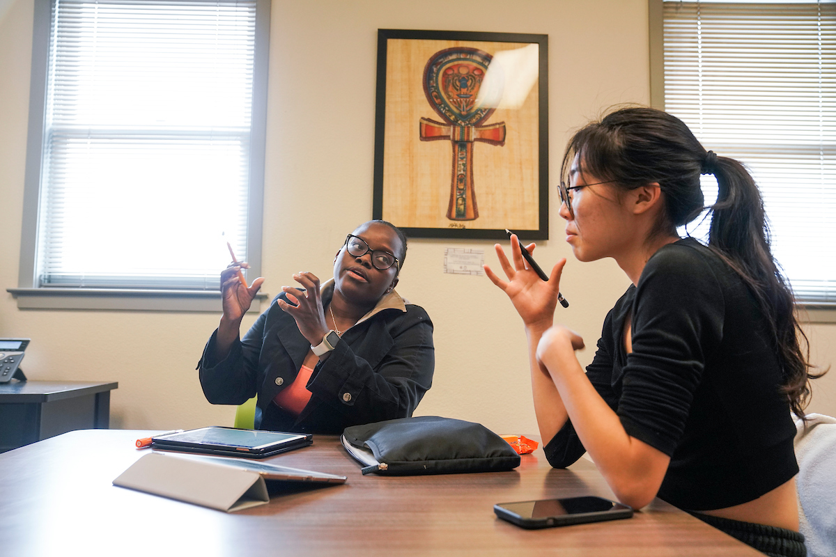 A student receives help from an AATC tutor at the Center for African Diaspora Student Success Center