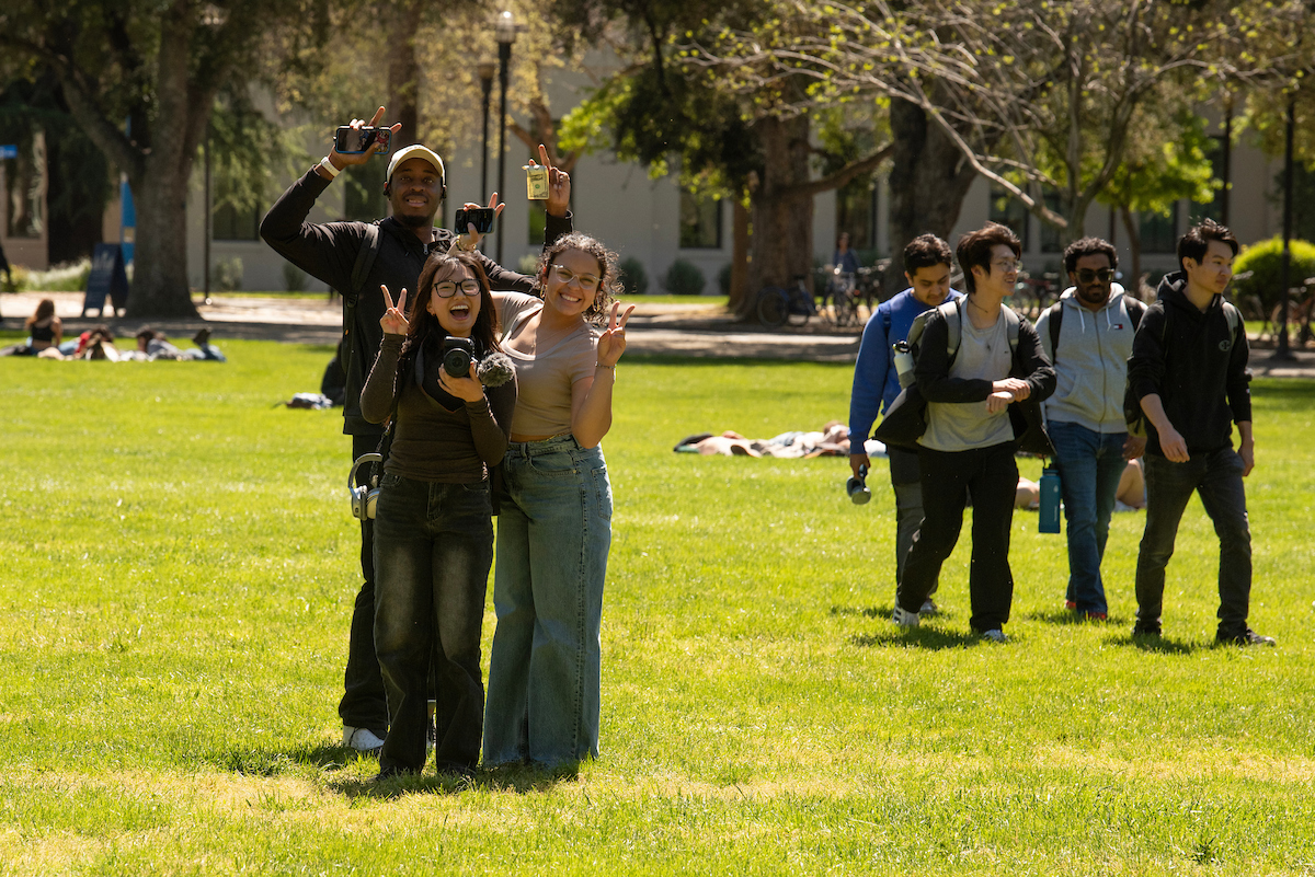 Students pose for a picture on the quad