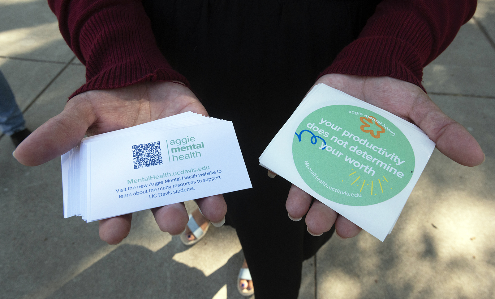 Aggie Mental Health Ambassador distributes stickers