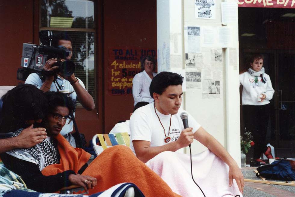 Strikers seated, microphone