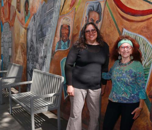 Kim and Miranda in front of the mural
