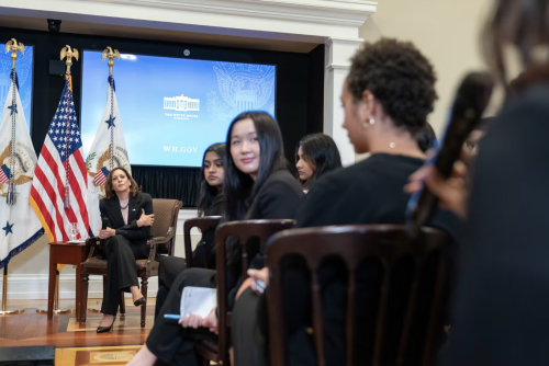 Ashley Chan turns to listen to a fellow student leader at the White House